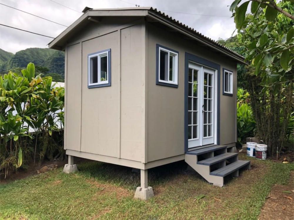 Studio shed with custom roof with french doors with stairs