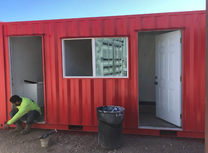 Shelton's Auto Masters Two Bathrooms and Office Space showing exterior looking into open doors
