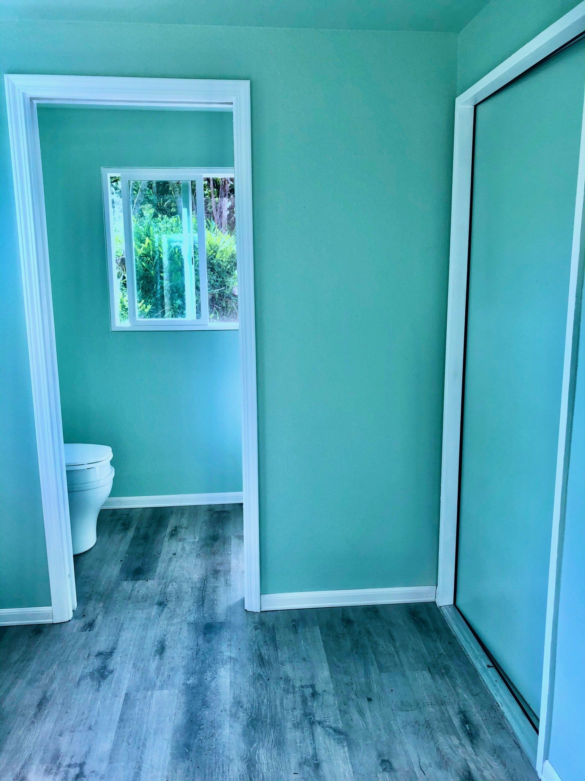 Custom Shipping Container Interior with blue green decoration and partitioned toilet