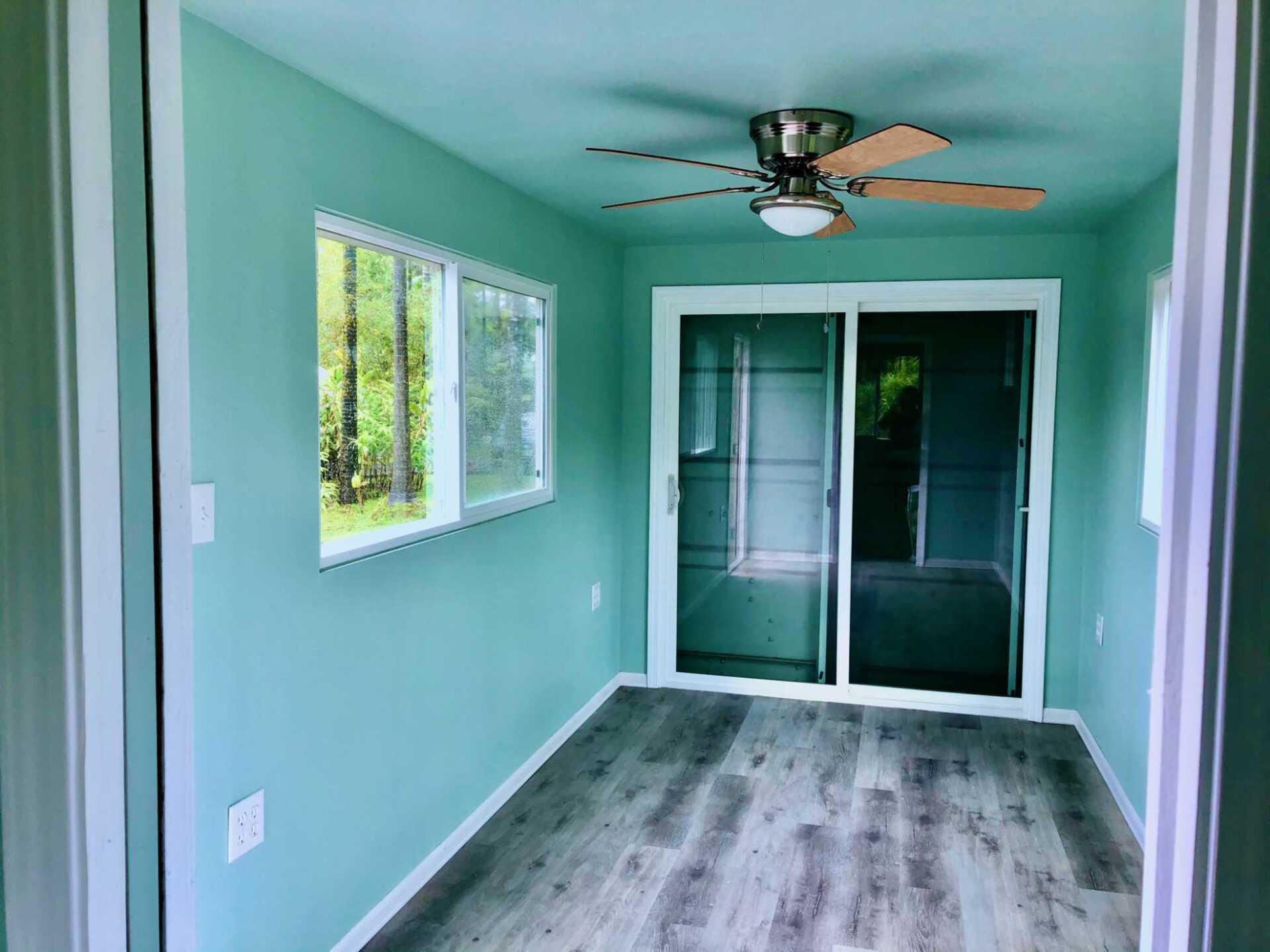 Interior custom designed shipping container with ceiling fan