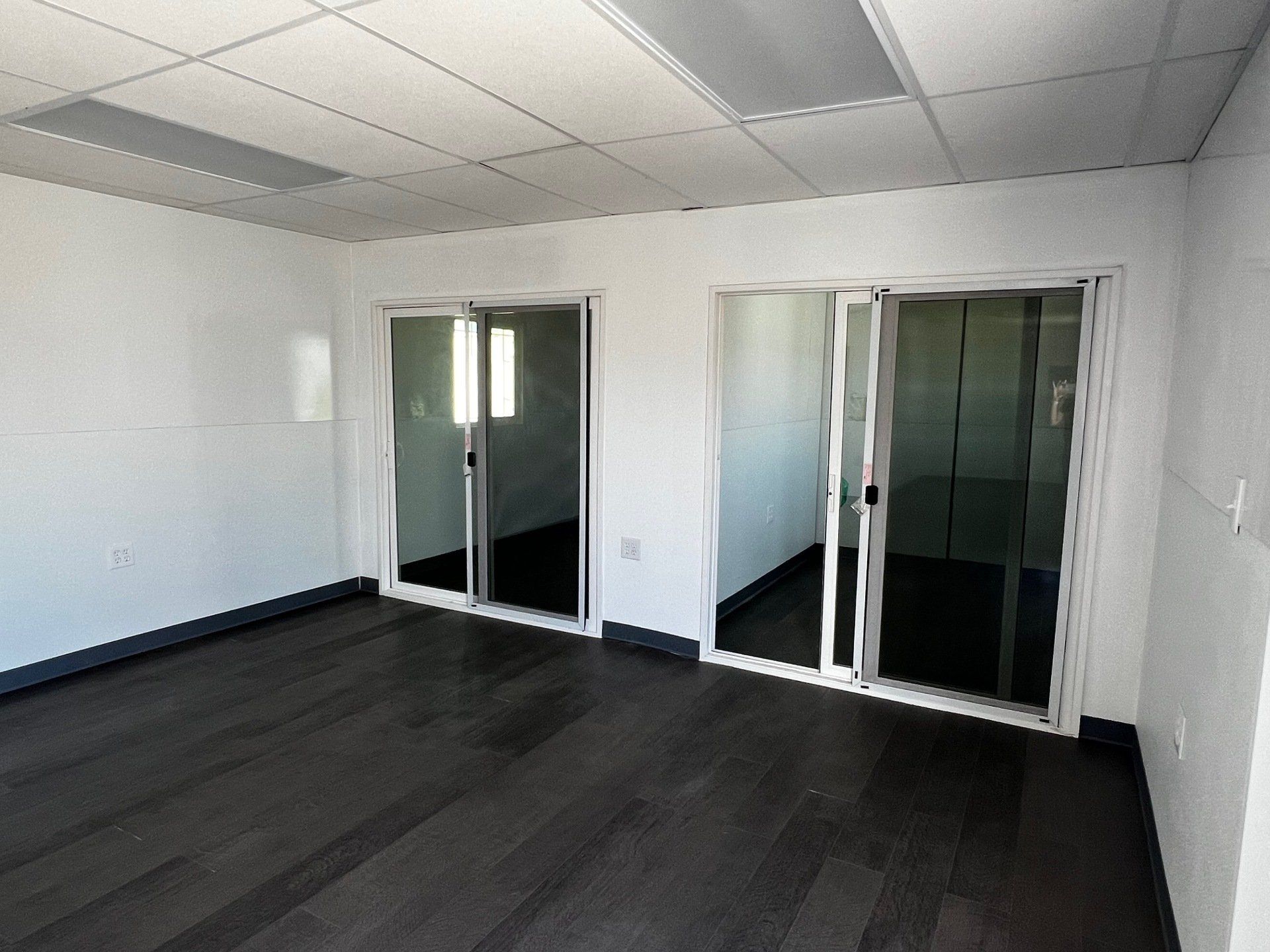 Custom and Multiple Wide interior office space with double sliding door partitions
