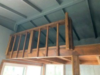 Studio shed with custom interior loft railing