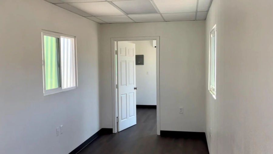 Mobile office interior image showing room with open door and finished flooring