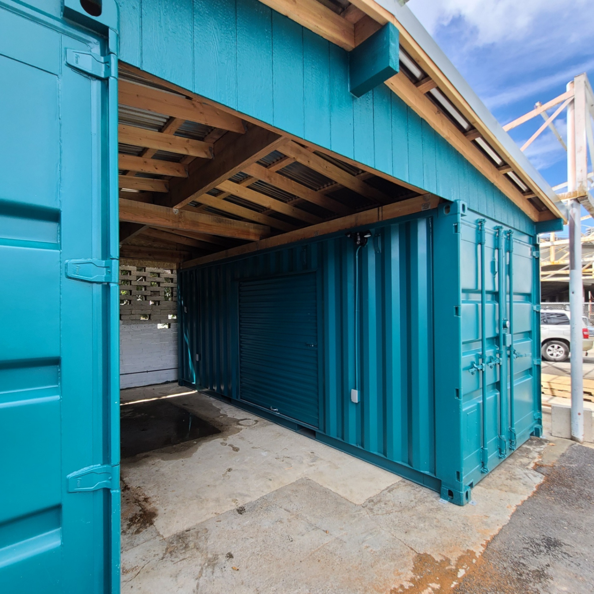 Custom storage solutions using multiple containers and roof