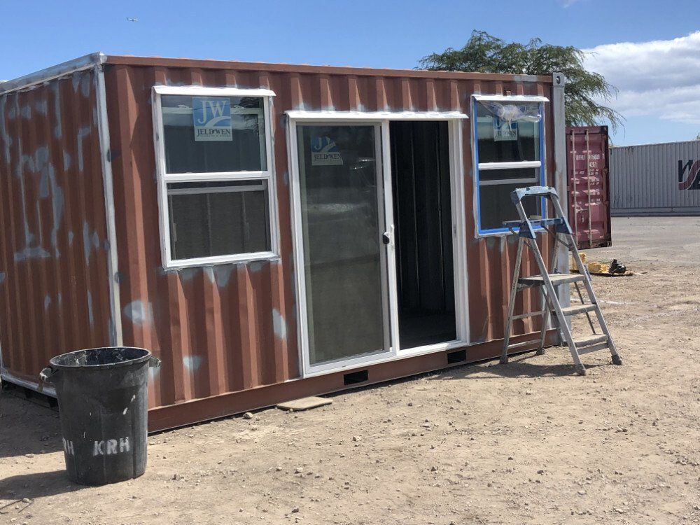 Backyard Office with sliding doors being painted