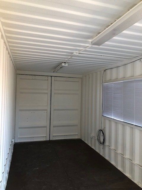 Contractor Office Interior with window and end doors