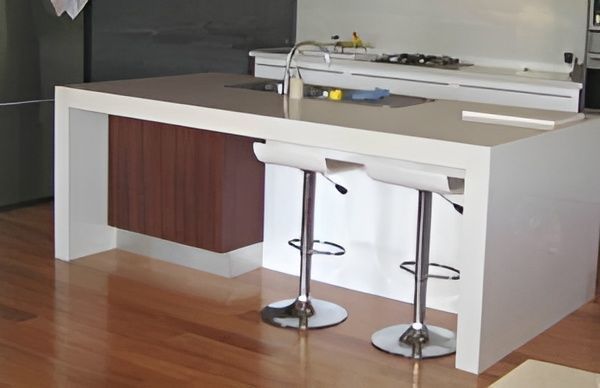 A Kitchen With a Large Island and Two Bar Stools — GC Joinery in Sunshine Acres, QLD
