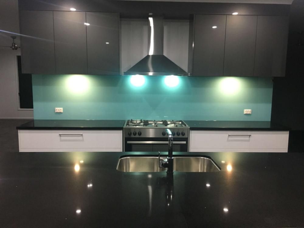 A Kitchen With a Stove Top Oven and a Sink — GC Joinery in Sunshine Acres, QLD