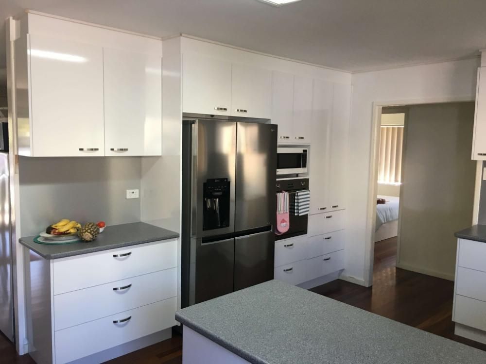 A Kitchen With White Cabinets and a Stainless Steel Refrigerator — GC Joinery in Sunshine Acres, QLD