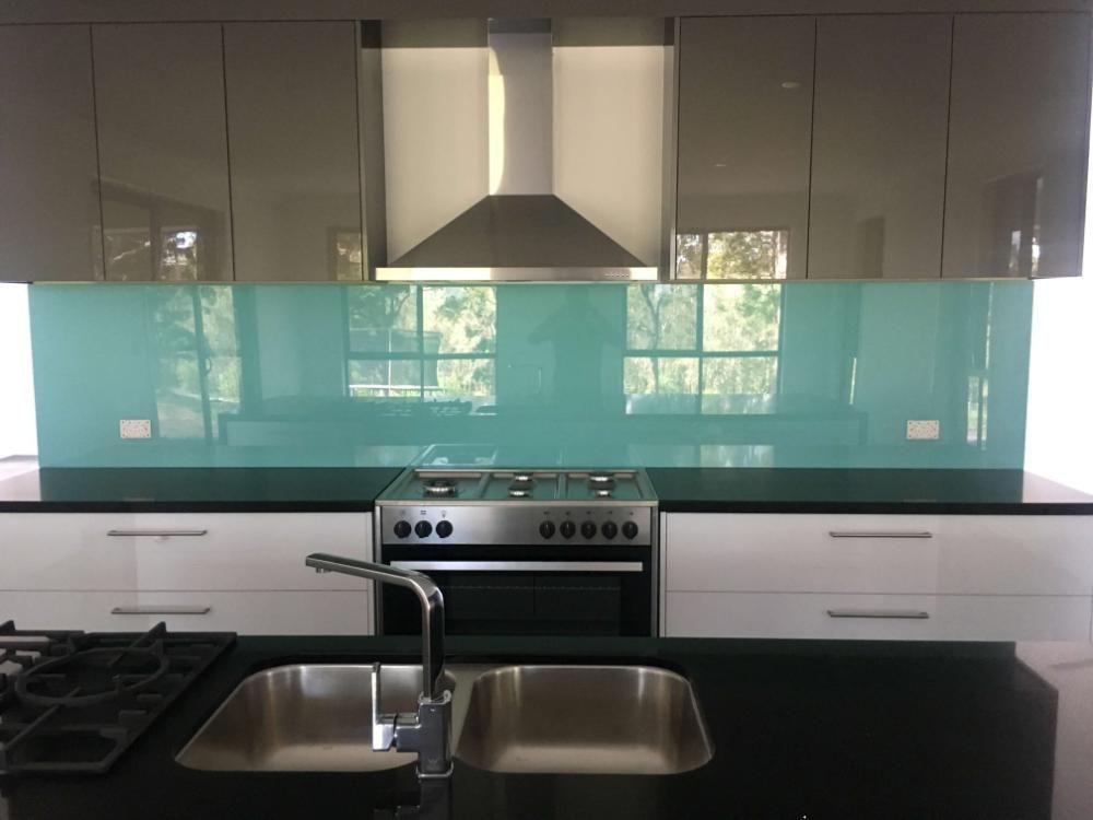 A Kitchen With Two Sinks and a Stove Top Oven — GC Joinery in Sunshine Acres, QLD