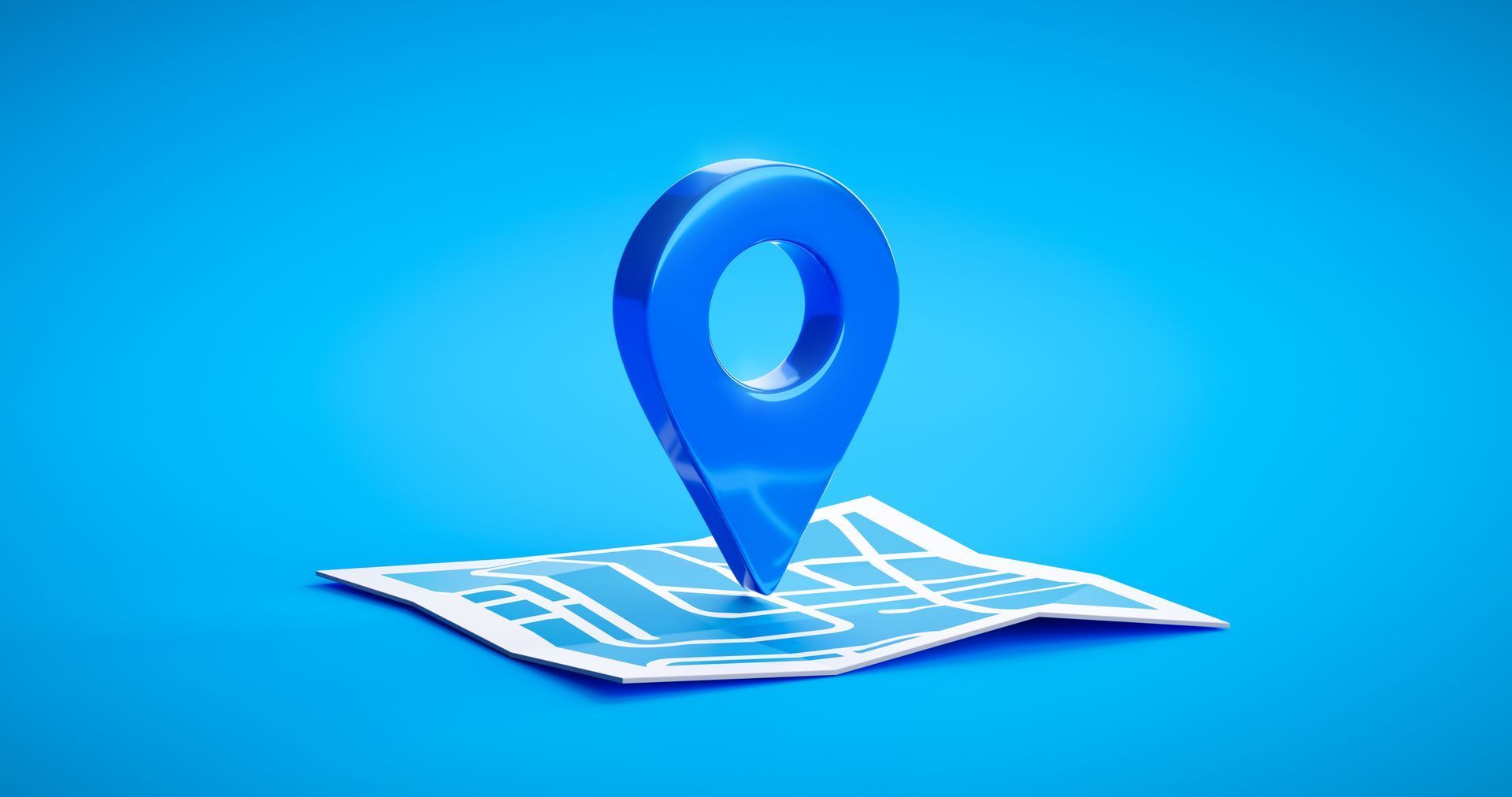Blue map pin marker on a folded map against a bright blue background.