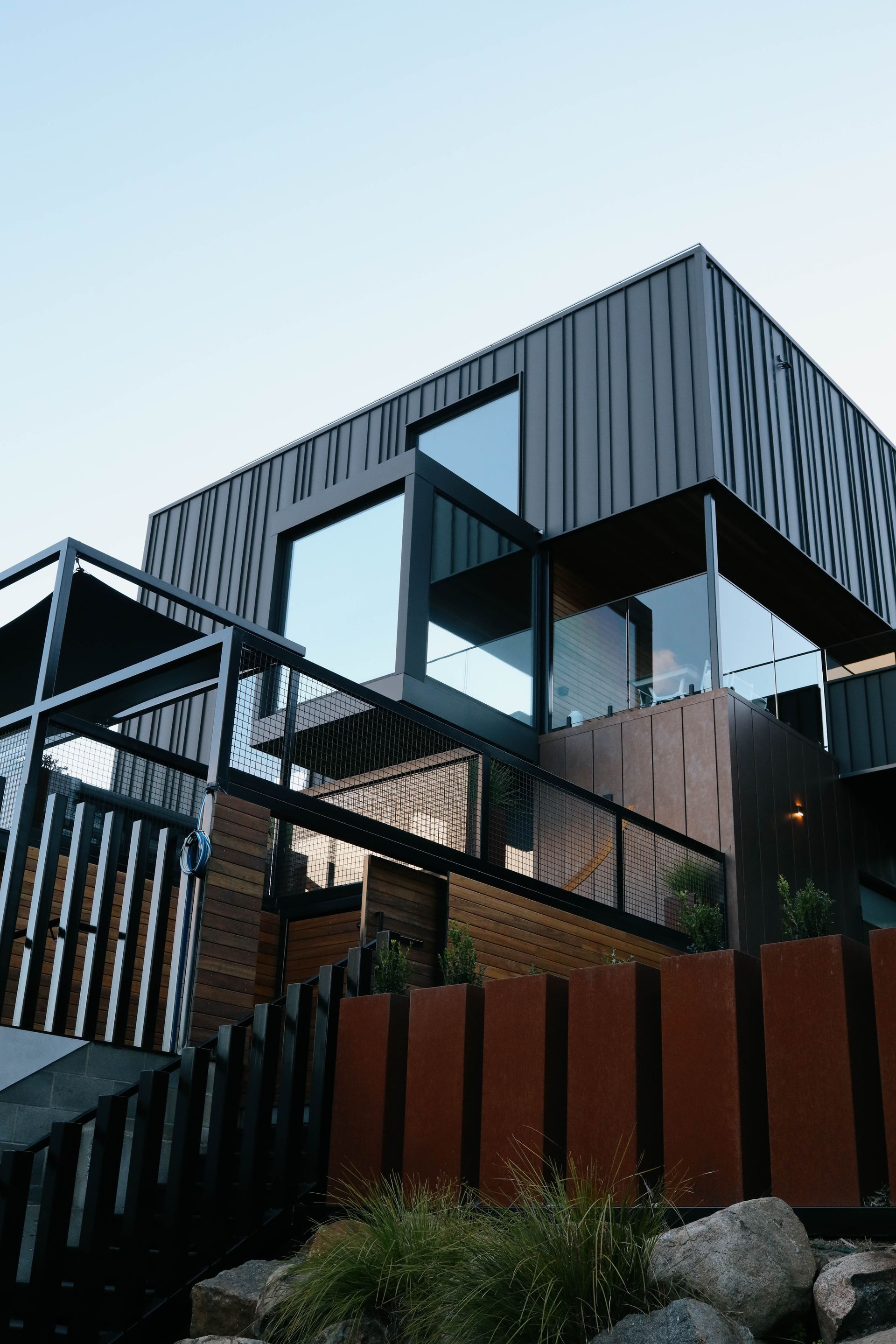 A large house with a lot of windows and stairs