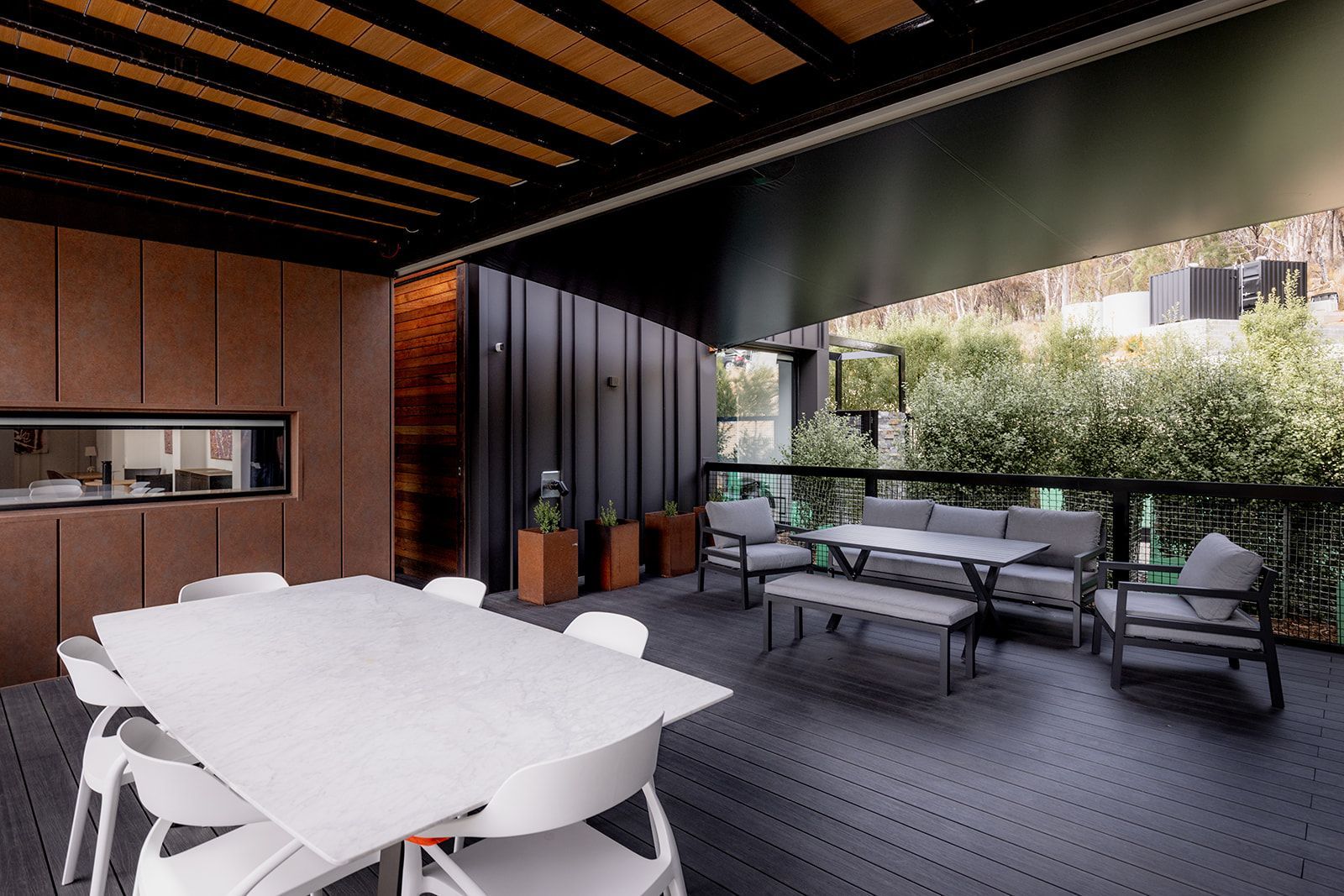 There is a table and chairs on the deck.