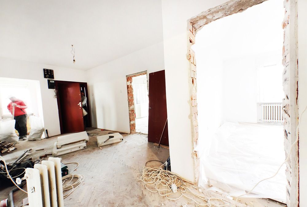 A Room that Is Being Remodeled with A Man Standing in The Background — Glen Lamberts Wall Cladding & Home Improvements in Wingham, NSW