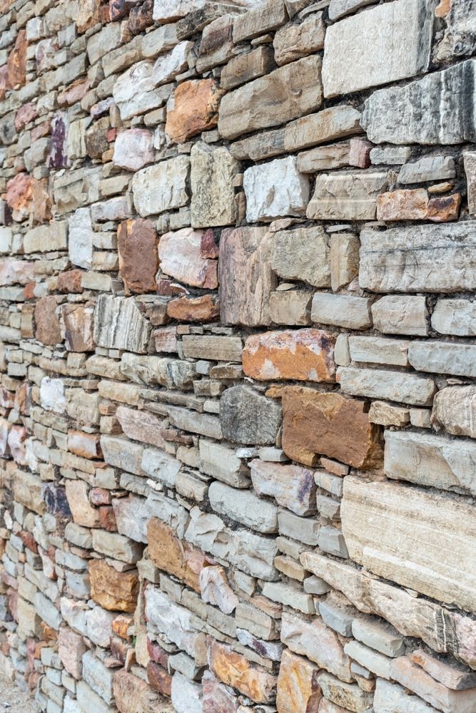 A Close Up of a Stone Wall Made of Different Types of Rocks — Glen Lamberts Wall Cladding & Home Improvements in Maitland, NSW