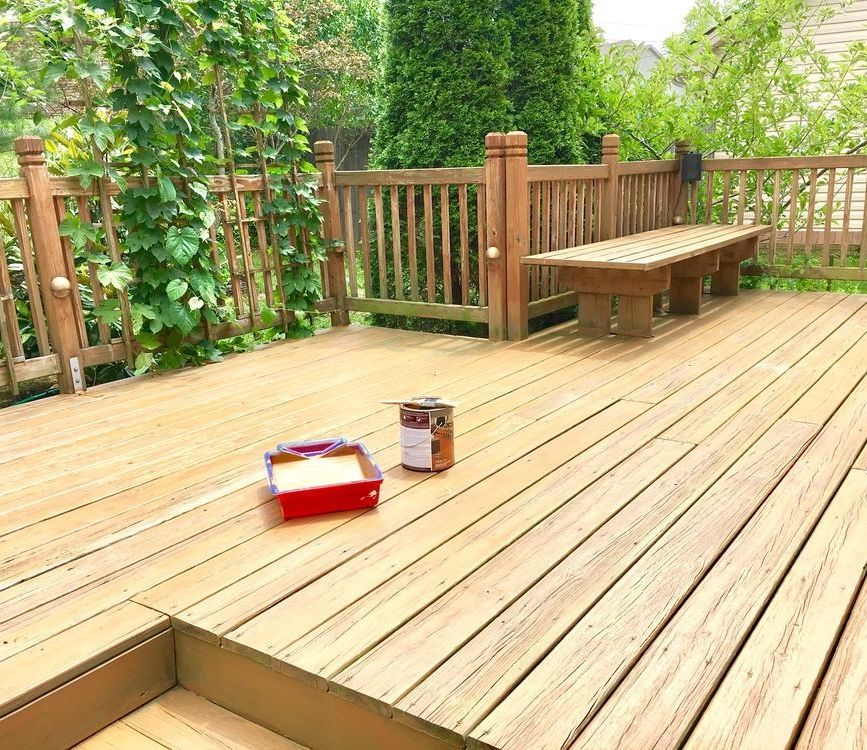A Wooden Deck With a Bench and a Can of Paint on It — Glen Lamberts Wall Cladding & Home Improvements in Newcastle, NSW