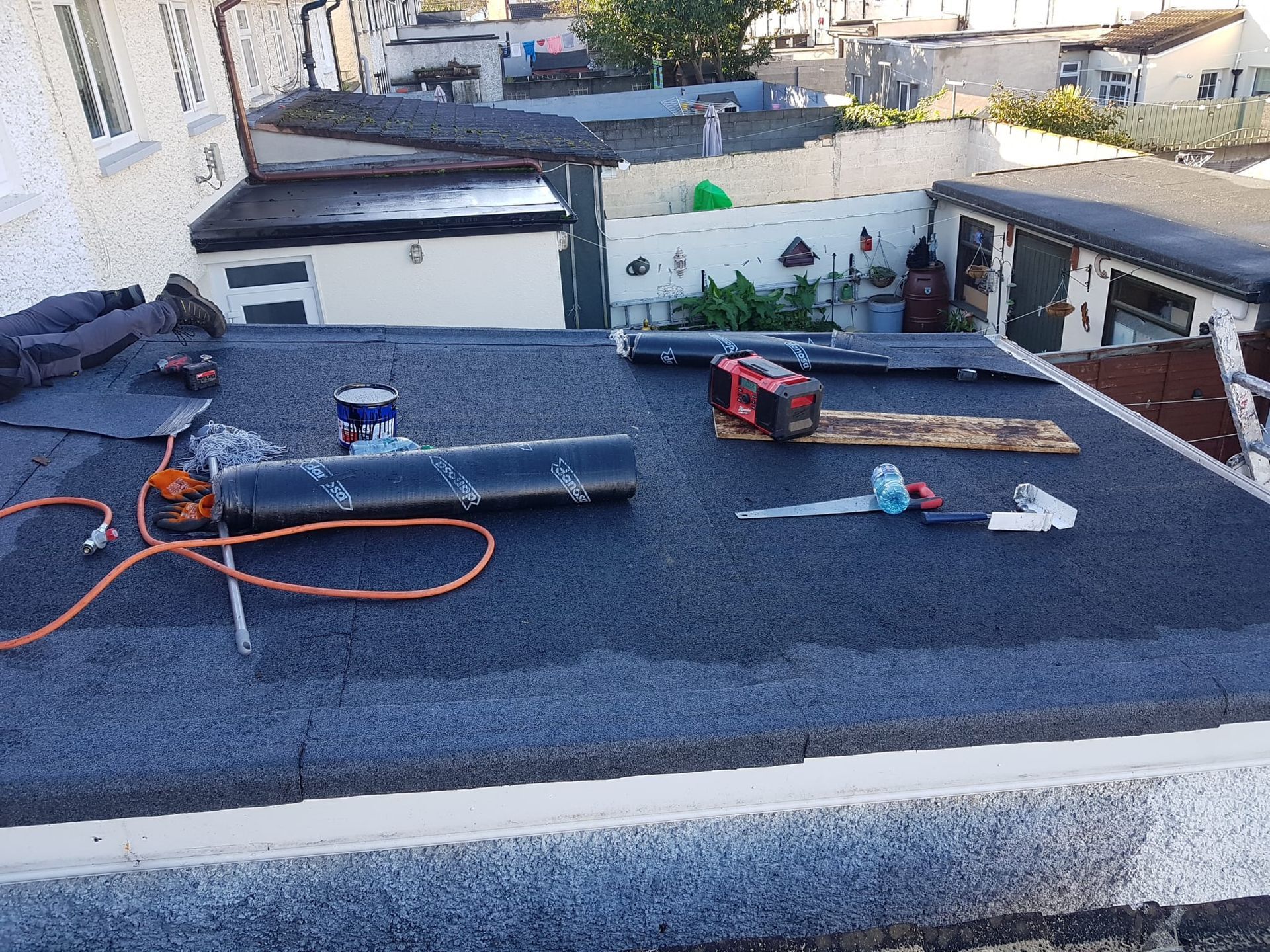 A roof with a lot of tools on it is being worked on.
