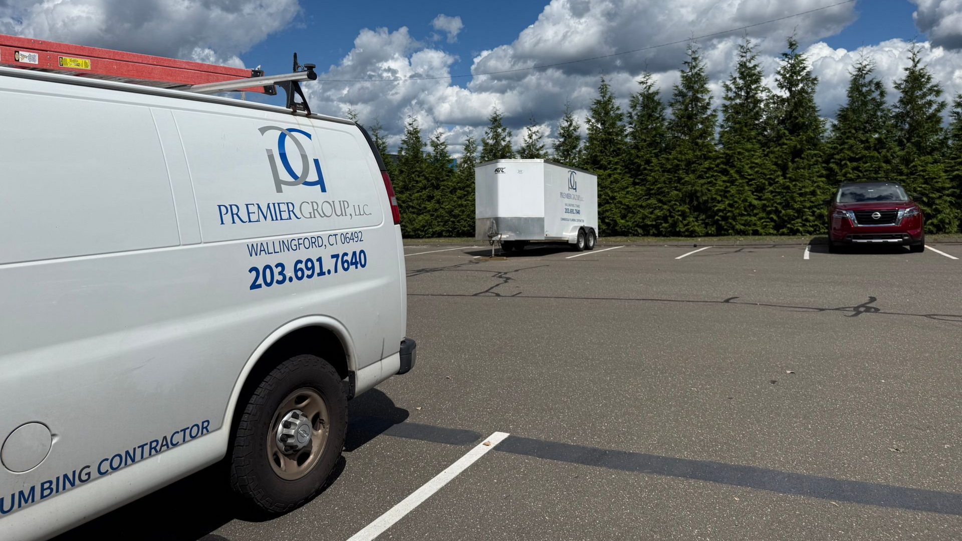 Construction site with foundation framework, heavy machinery, and workers.