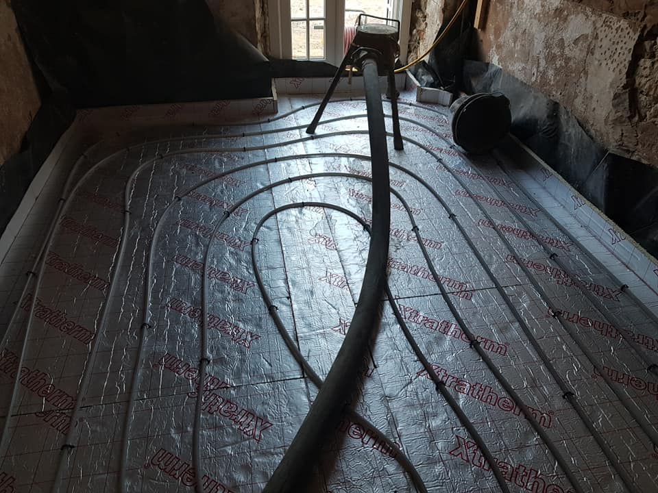 a hose is laying on the floor in a room .