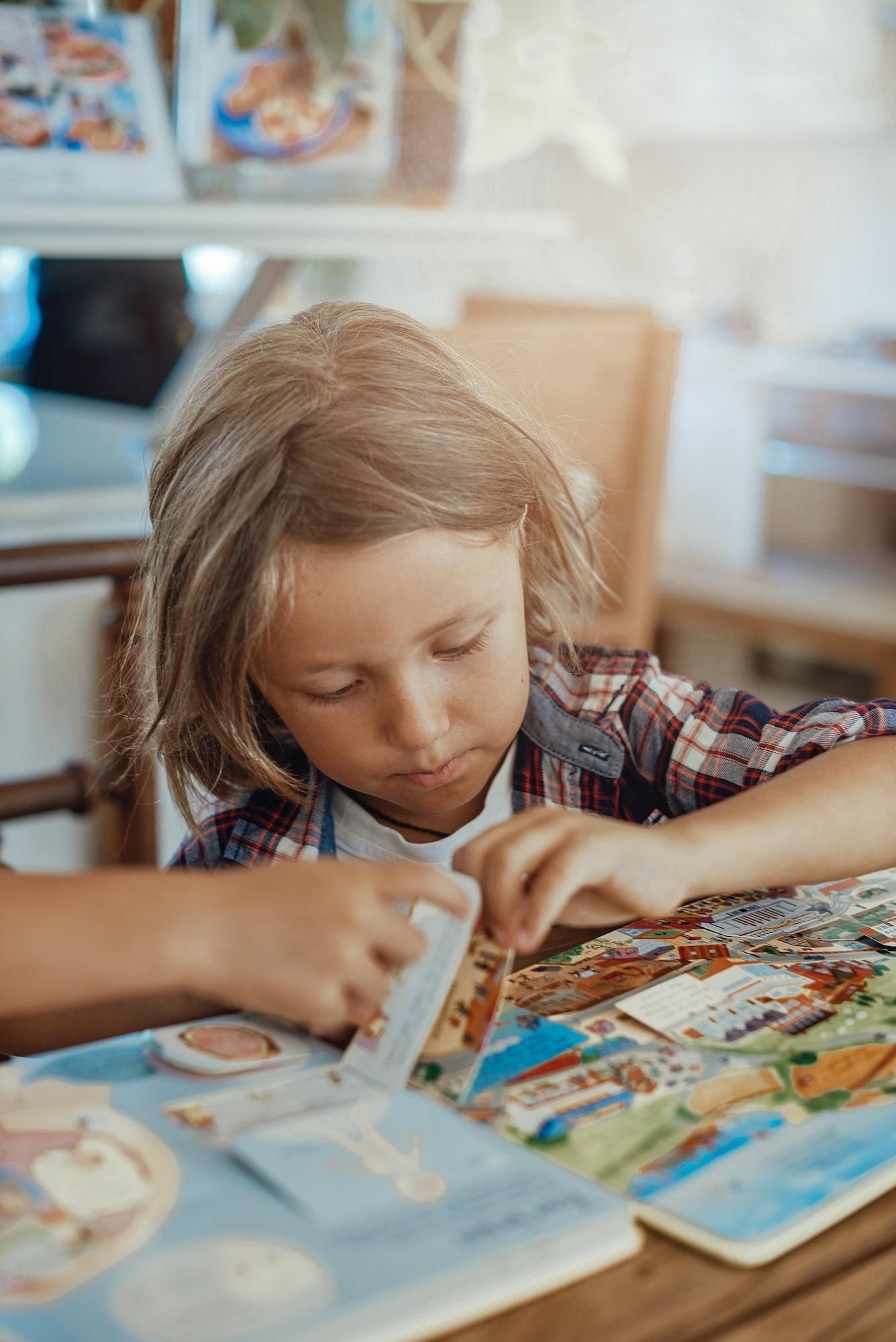 boy flipping through sensory book