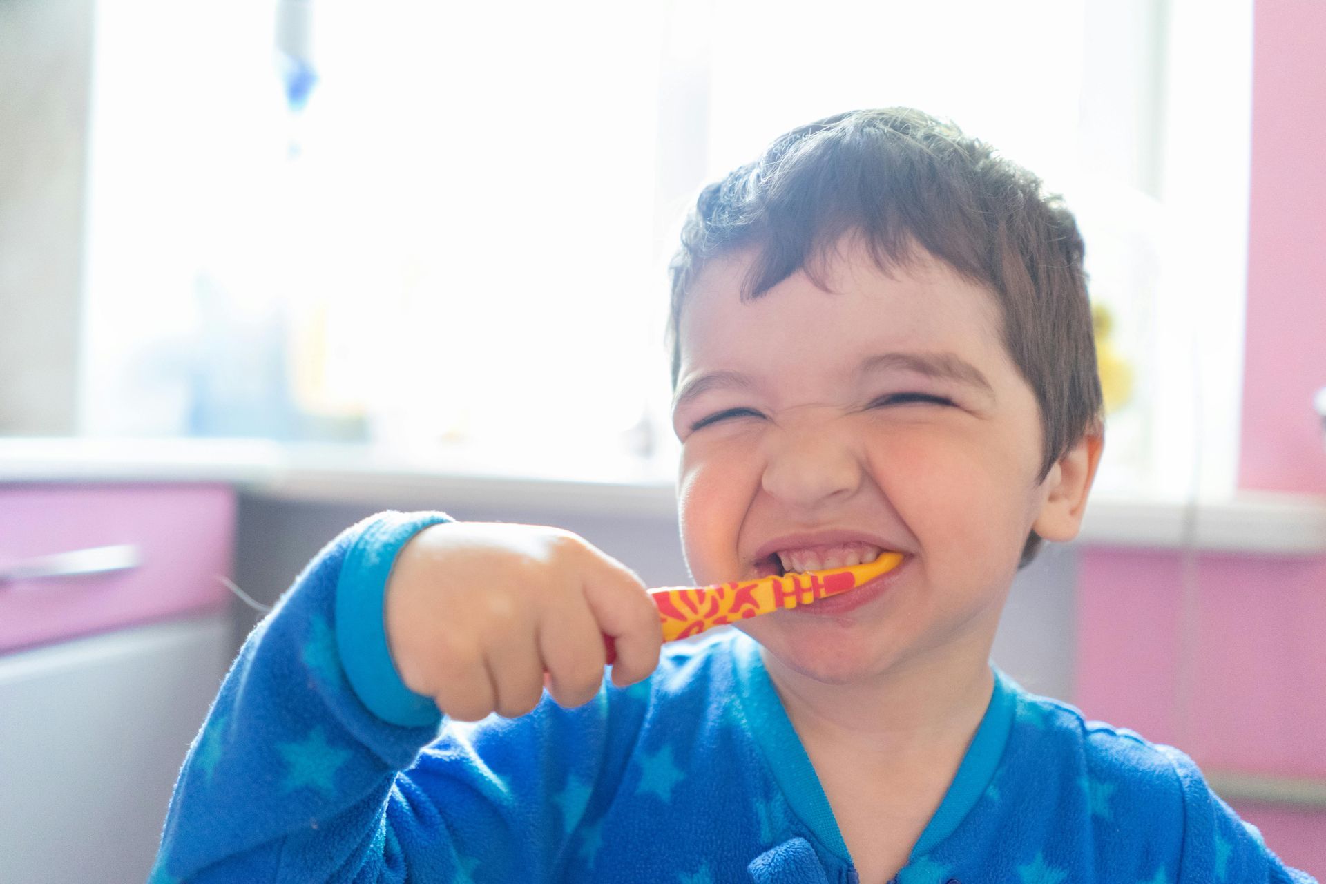 child brushing his teeth