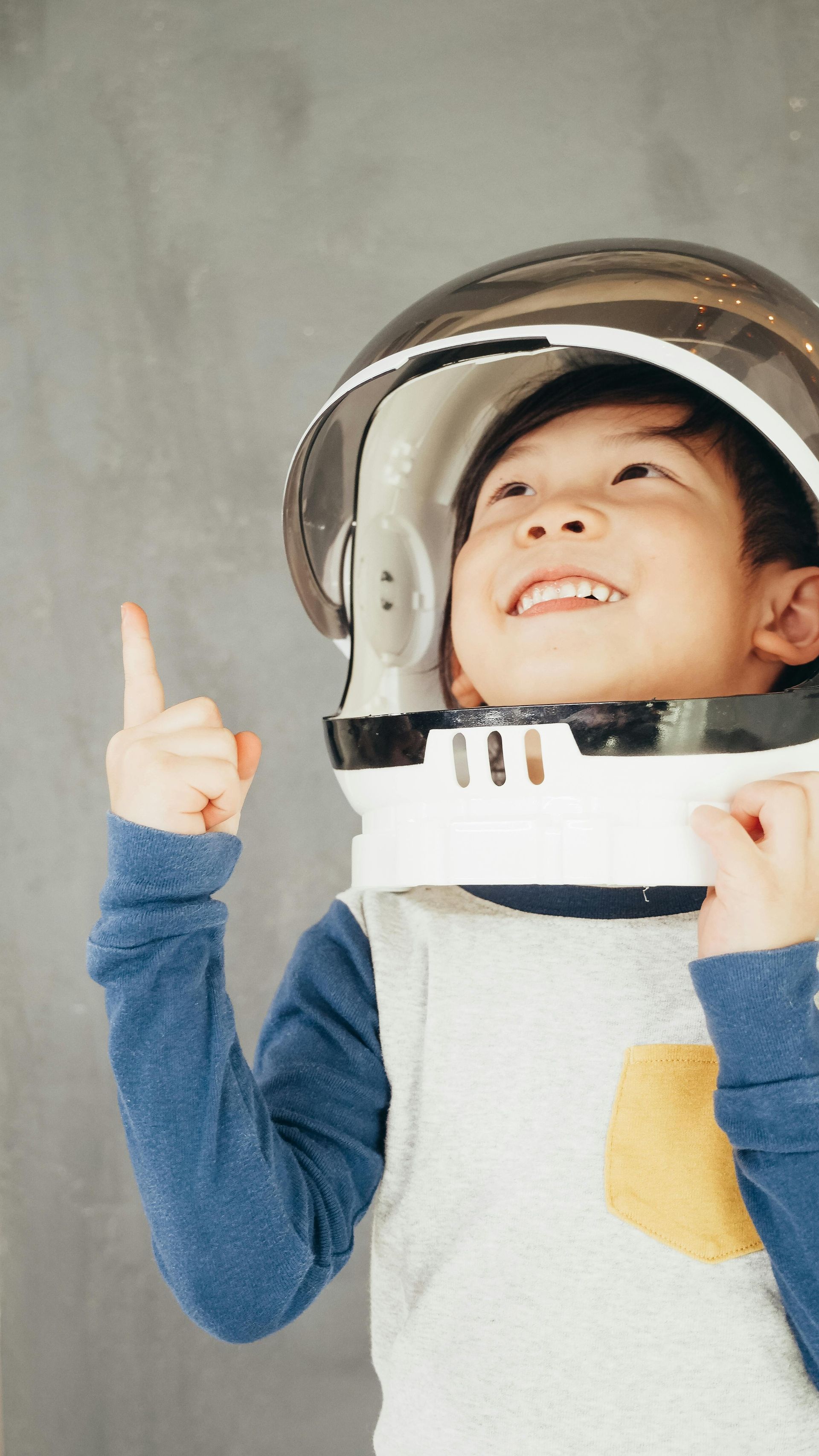 child wearing astronaut helmet