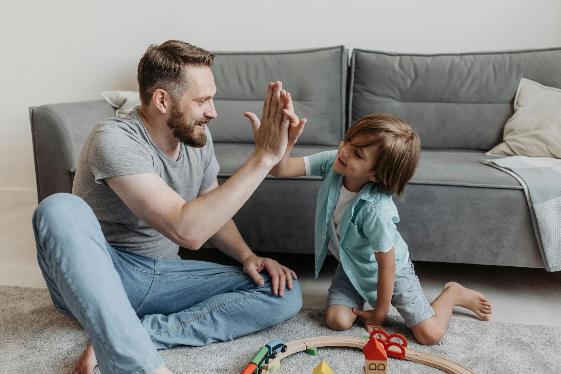 dad giving child a high five