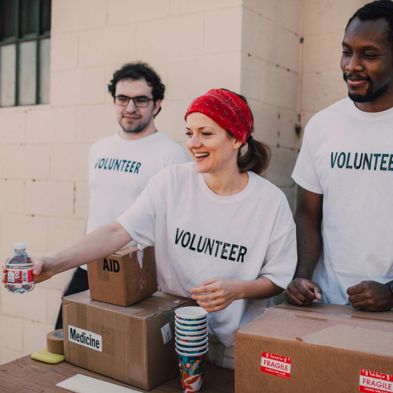 stock photo of three people wearing white shirts with 