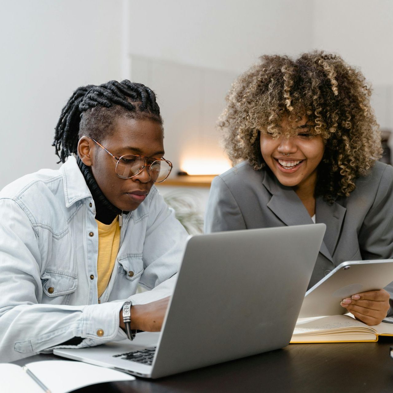 stock phot of two people looking at a laptop