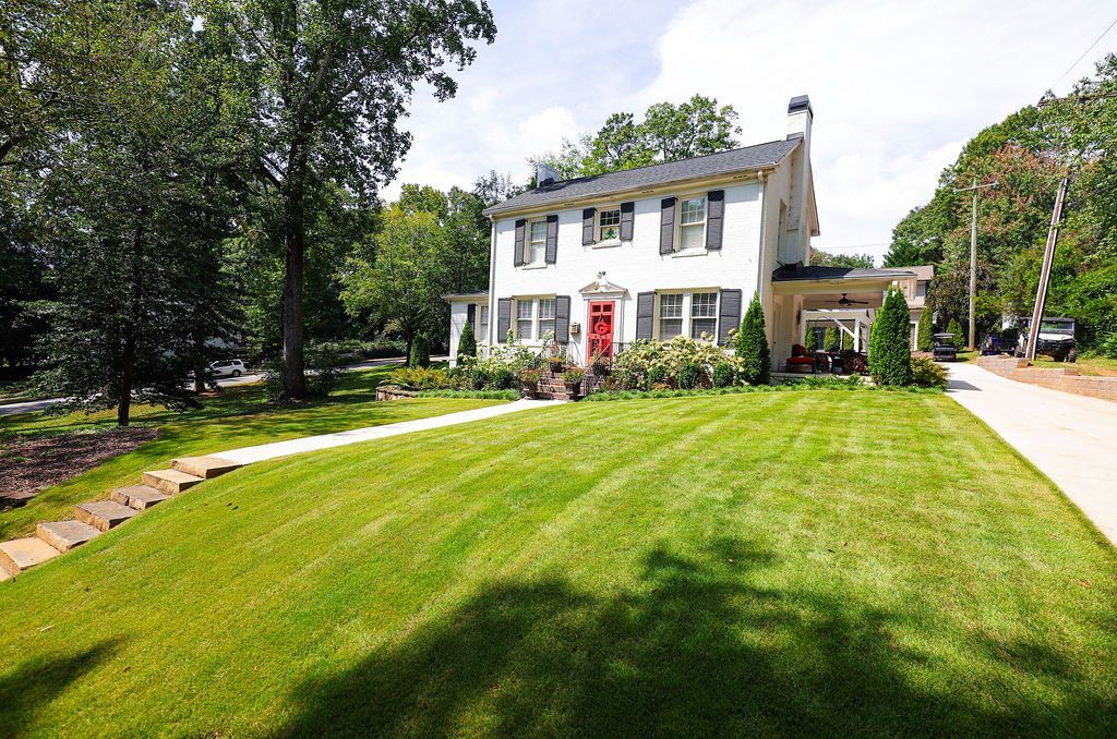 Colonial style house with sod.