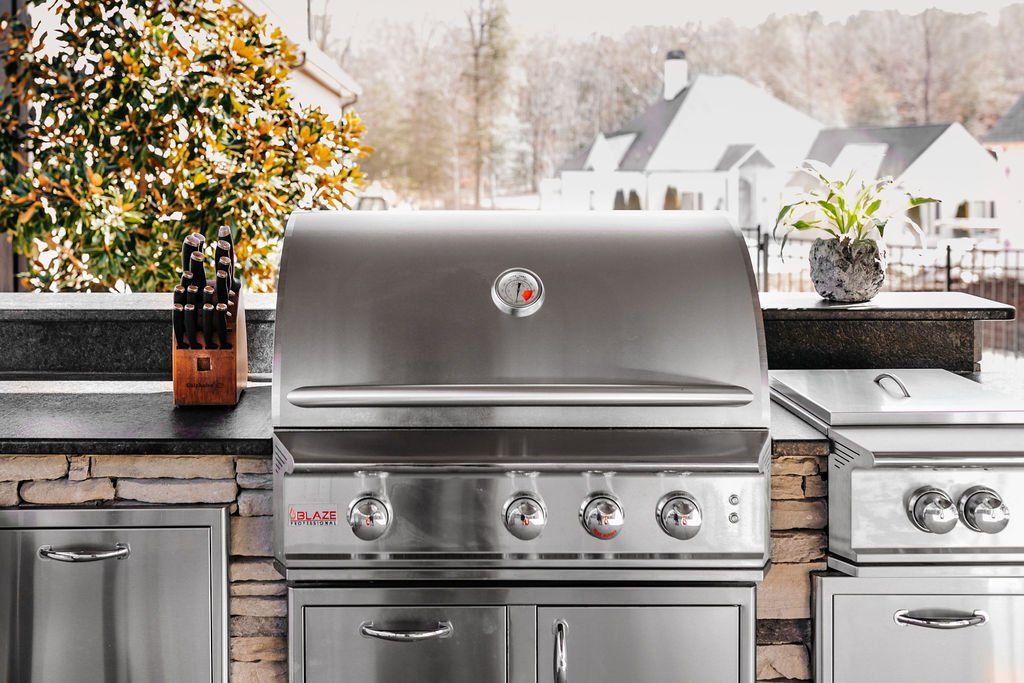 BullBBQ outdoor grill with stainless steel griddle and trashcan. 