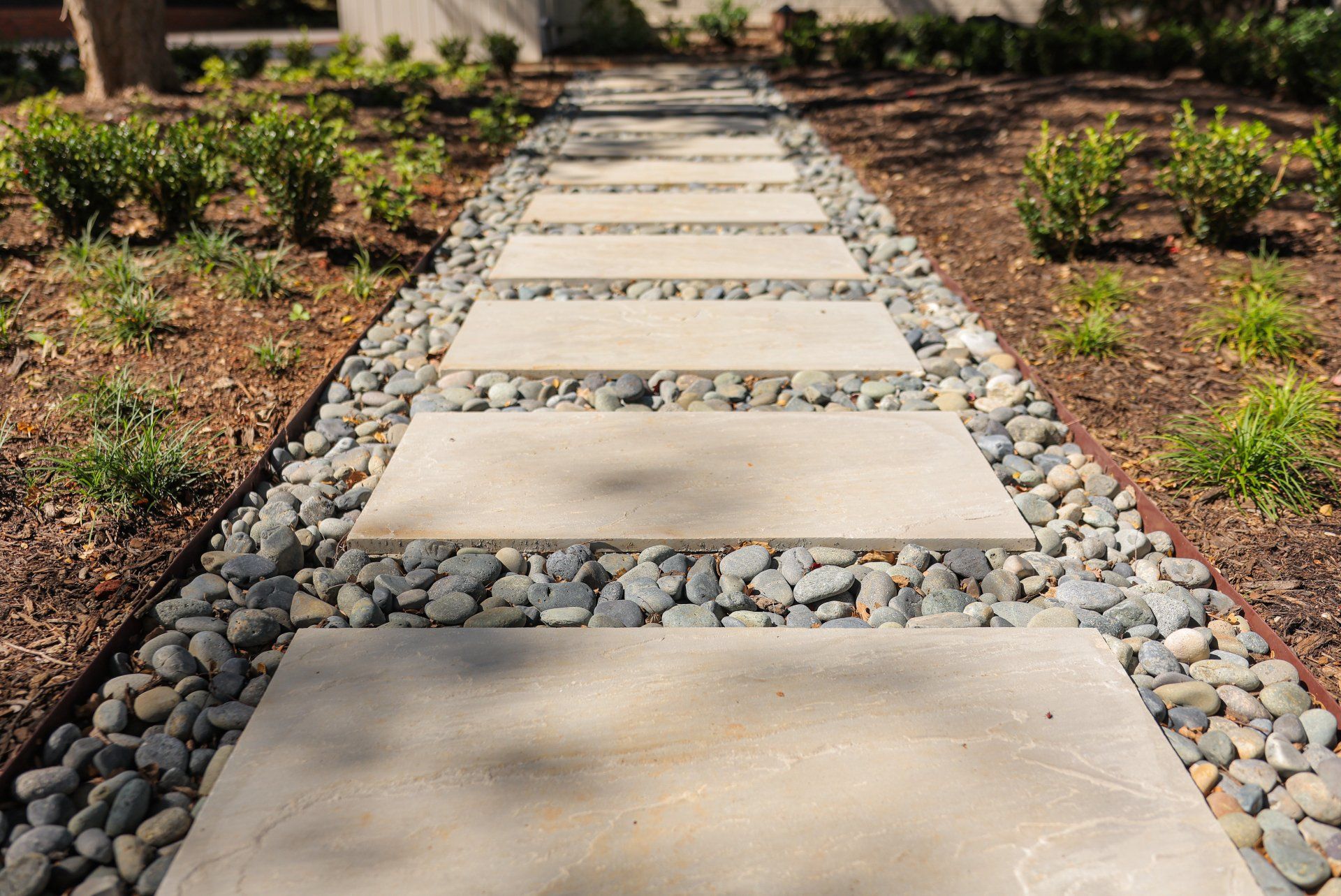 Bluestone step treads with Mexican beach pebble.