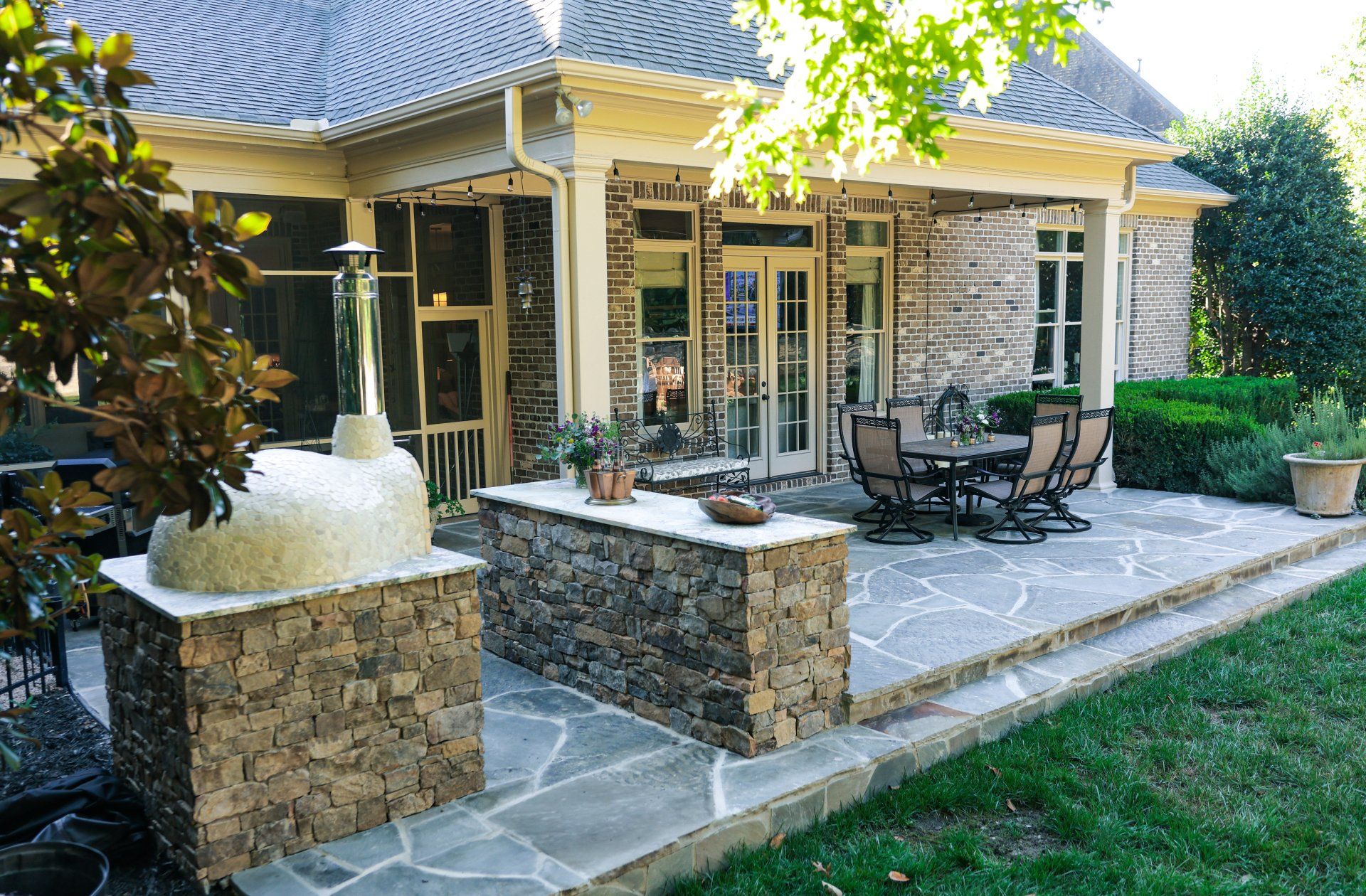 Flagstone Patio with bar and pizza oven.