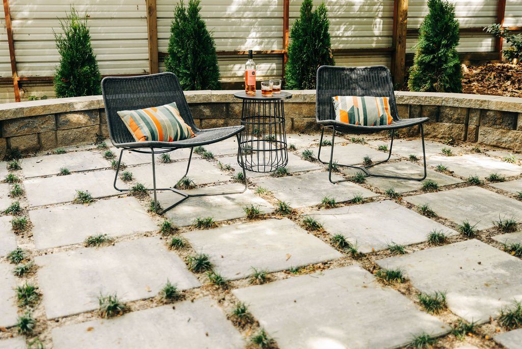 Private patio with pavers and mondo grass joints.