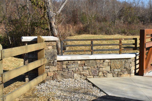 Precast — Closer View of Steel Bridge and Wood Fence in Bartlett, TN
