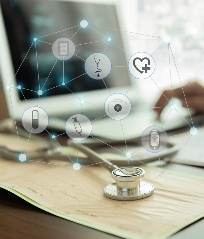 A stethoscope is sitting on top of a piece of paper in front of a laptop computer.