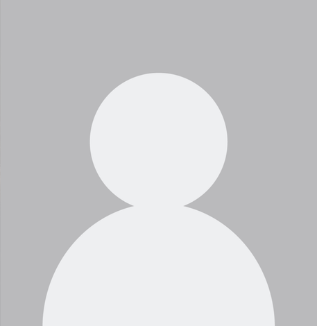A silhouette of a person without a face on a gray background.