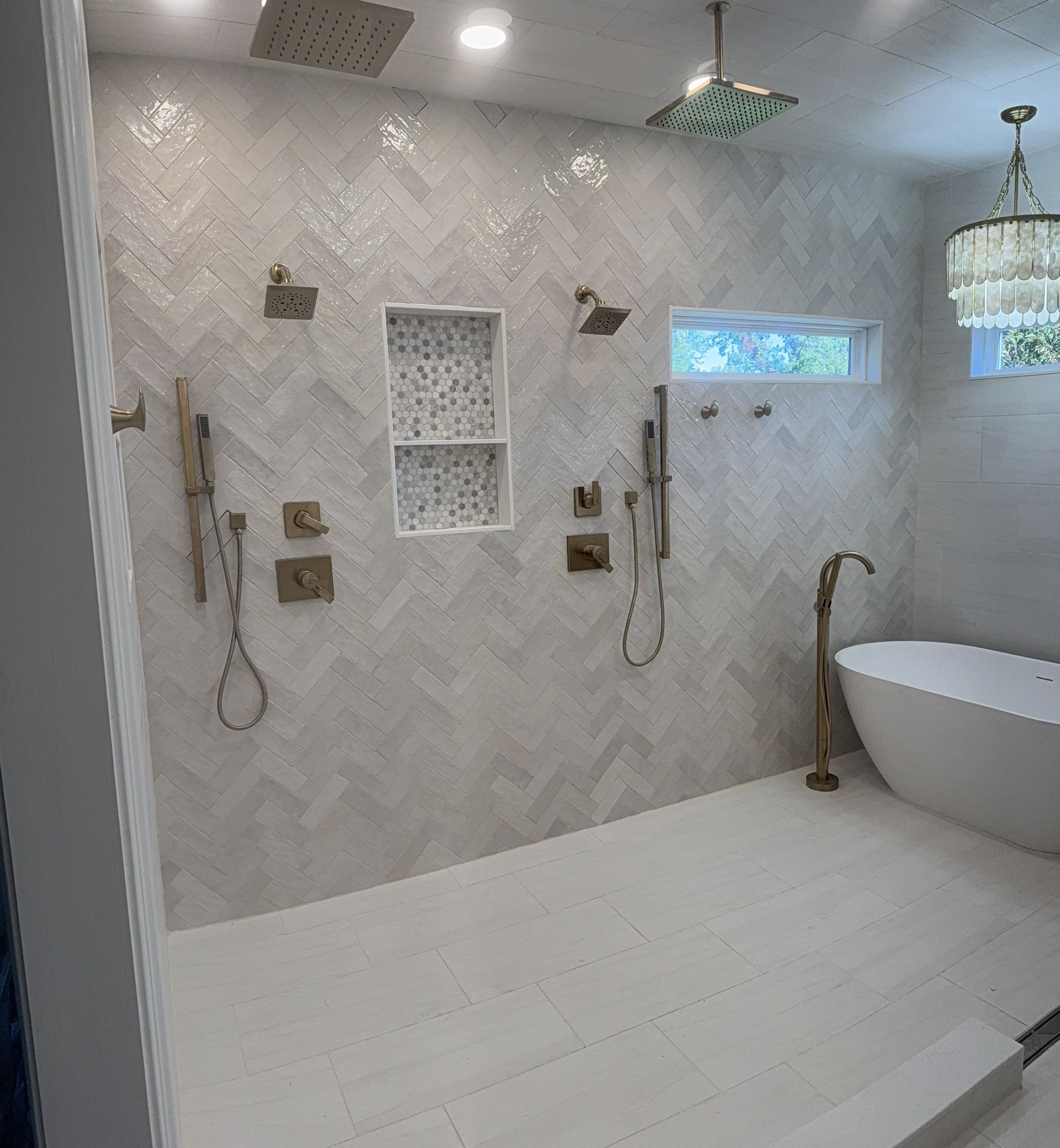 Woman in straw hat smiles, holding wine glass near a lake.