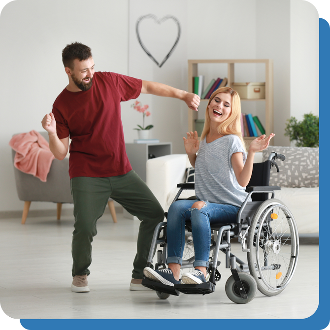 Woman with disability sitting in wheelchair and man dancing