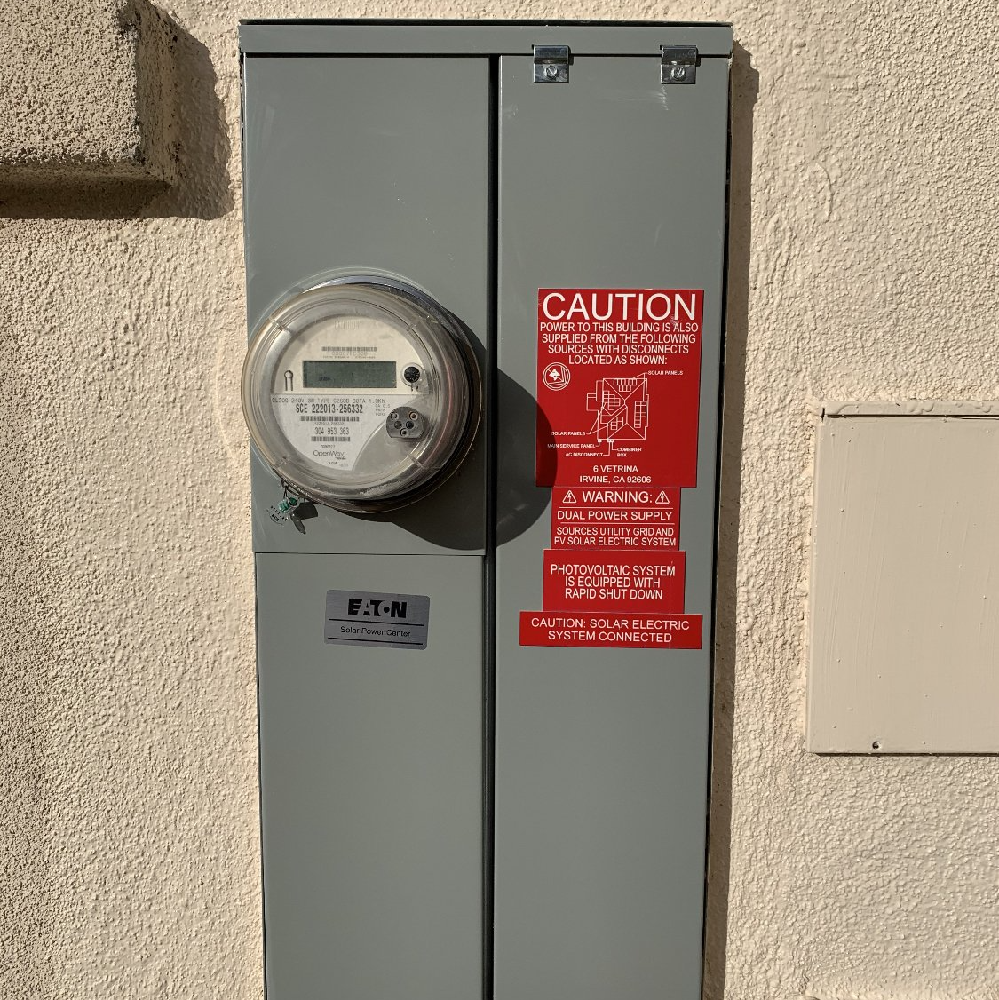 An upgraded electrical panel on the outside of a house