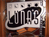 A sign that says lunas is on a window