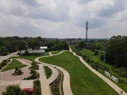 An aerial view of a park with a path going through it.