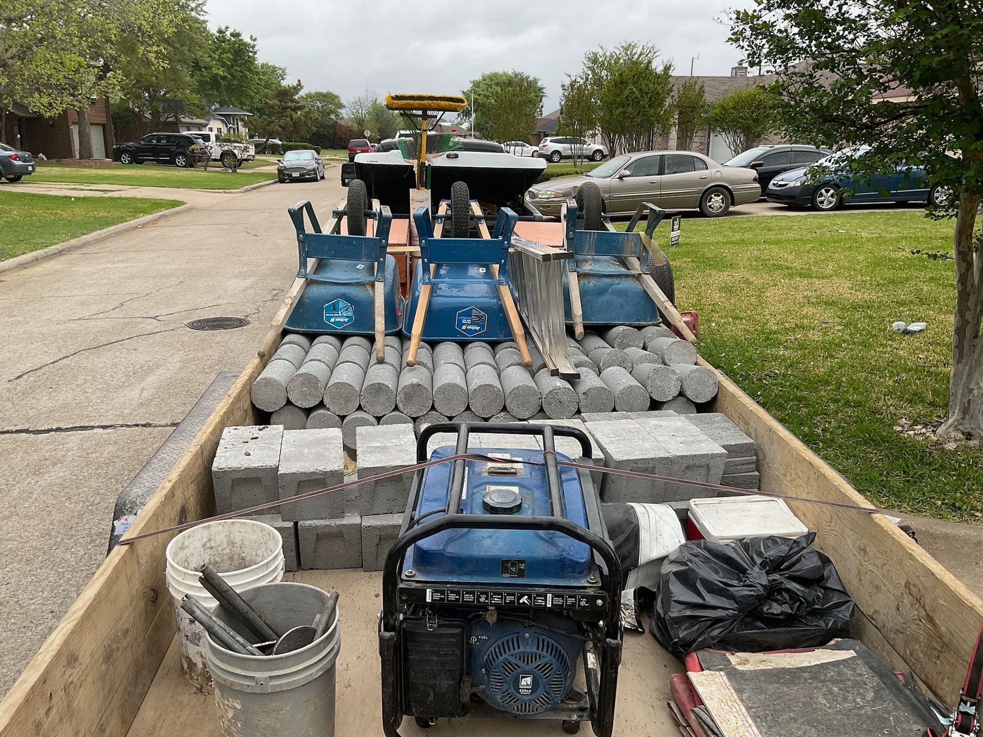 a blue generator sits in the back of a trailer