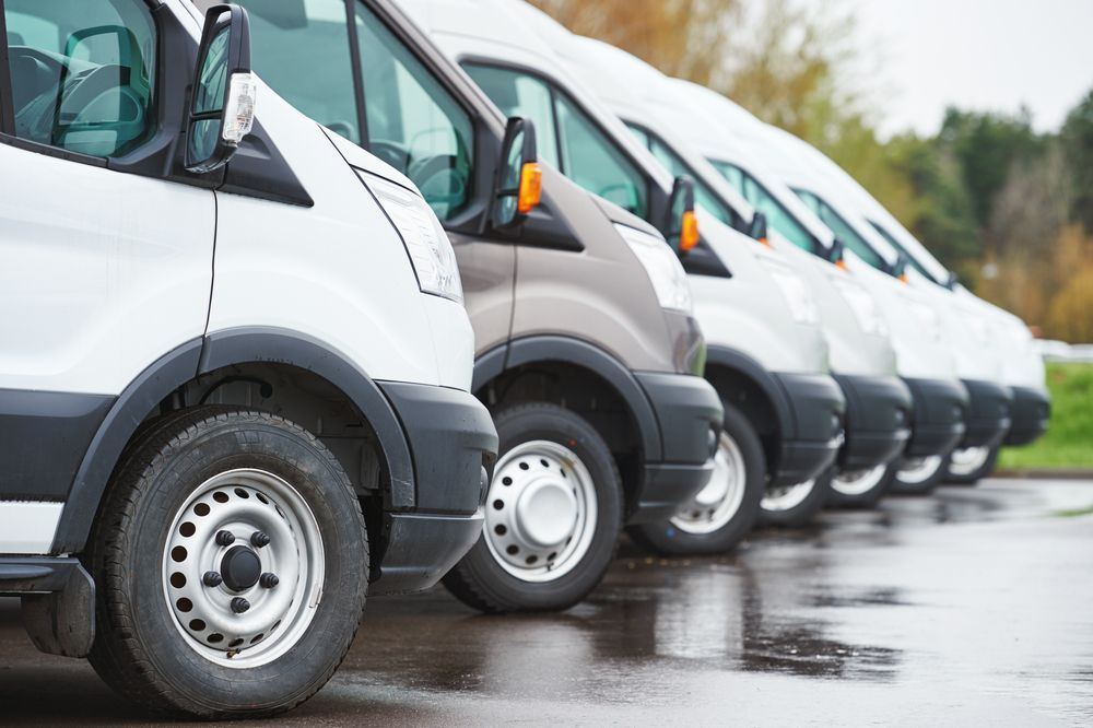Line of Vans Parked in a Row Mostly White and Brown — Road Runner Windscreens in South Grafton, NSW