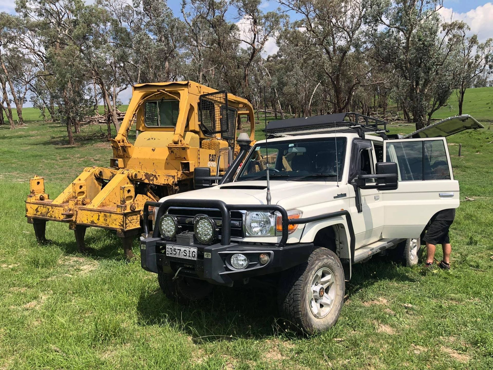 White 4x4 Vehicle With a Person Standing Next to It — Road Runner Windscreens in Yamba, NSW