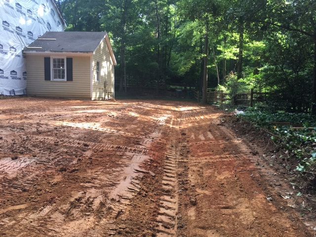 Regrading for runoff and drainage improvement next to a home. 