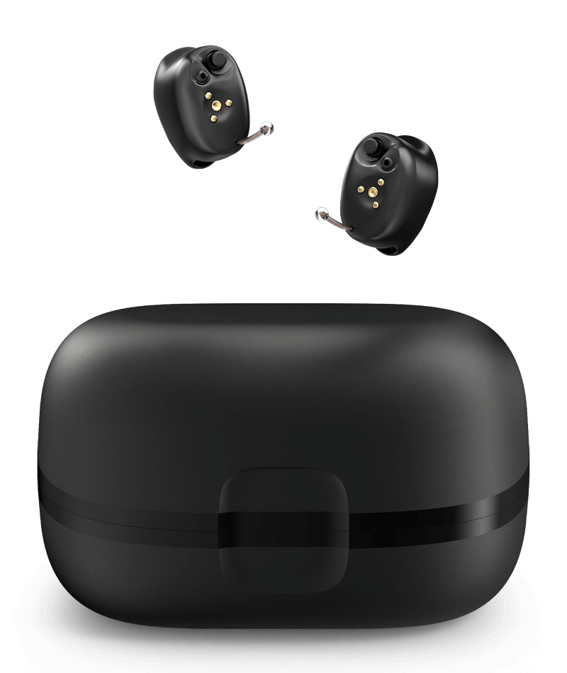 A pair of hearing aids sitting on top of a black case.