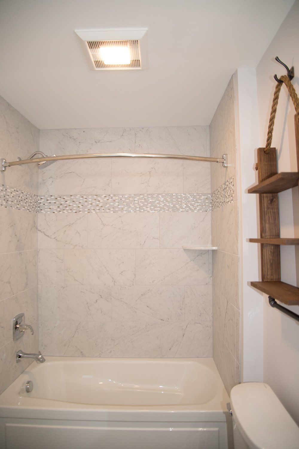 A bathroom with a bathtub and a toilet.