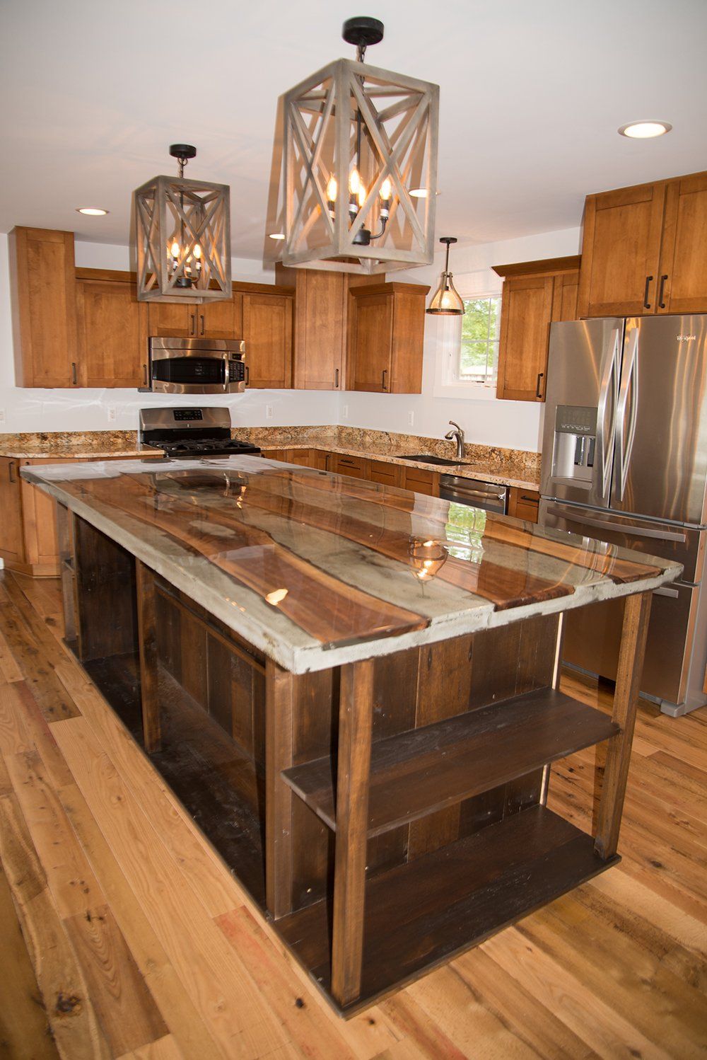 A kitchen with a large island in the middle of it.