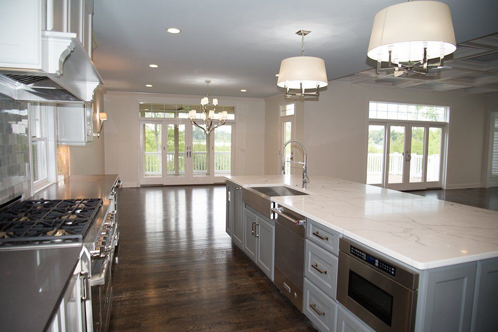 A large kitchen with stainless steel appliances and a large island.
